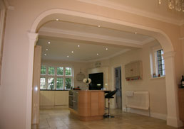 Bespoke arch, plain pilasters and kitchen cornice matched to existing. Kingswood, Banstead, KT20